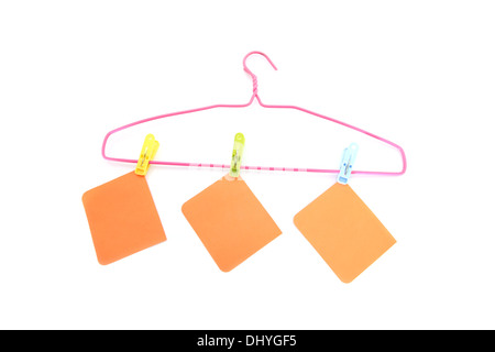 The Note paper and hanger on the white background. Stock Photo