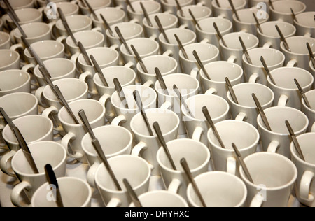 White cups saucers and spoons Stock Photo
