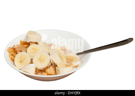 Bowl Of Breakfast Cereal With Milk Sugar and Banana Stock Photo