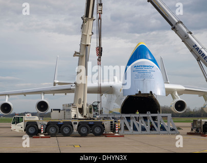 Partial view of Antonov An-225 during loading session on the Pleso, Zagreb airport, Croatia. Cranes and heavy cargo is seen. Stock Photo