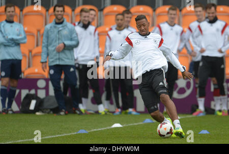London, Britain. 17th Nov, 2013. Germany's Jerome Boateng plays the ball in front of his teammates during a training session of the German national soccer team ahead of the friendly match against England, in London, Britain, 17 November 2013. Photo: ANDREAS GEBERT/dpa/Alamy Live News Stock Photo