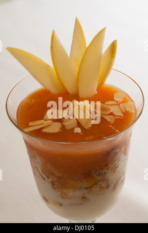Apple cup with medlars and soft almond milk Stock Photo