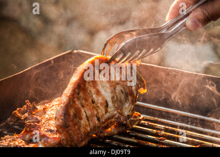 Closeup of steak on grill fire-toasted Stock Photo