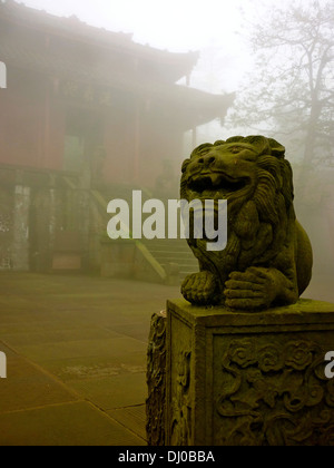 A stone statue at the entrance to a temple on Mount Emei, in Sichuan Province near Chengdu, China Stock Photo