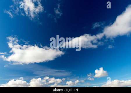 Sunny blue sky with dramatic white clouds Stock Photo - Alamy