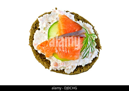 Sandwich of rye bread with cream, cucumber, dill and salmon isolated on white background from above Stock Photo