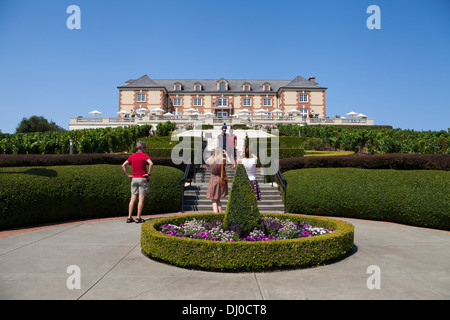 Tourists taking pictures in front of the Domaine Carneros Winery, Napa, California, USA. Stock Photo