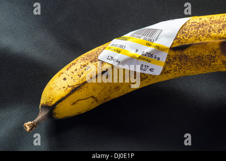One yellow  banana with German bar-coded label showing weight and price in Euro Stock Photo