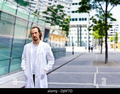 Young Scientist or doctor with confident personality standing in urban area Stock Photo