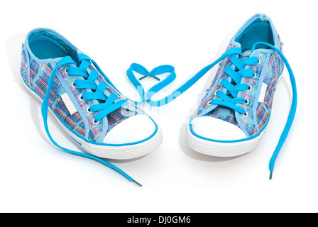 Pair of blue sneakers with laces isolated on white Stock Photo