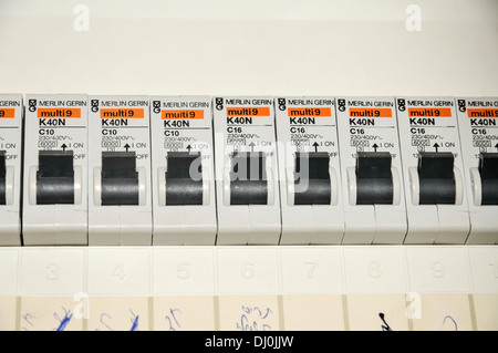 Domestic fuse box close up with trip switches circuit breakers Stock Photo