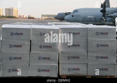 Manila, Philippines. 18th Nov, 2013. Palettes of relief goods from US Aid on the tarmac of Villamor Airbase in Pasay City before being loaded on to a US C130 cargo plane bound for Tacloban. -- Thousands of displaced individuals from Tacloban and Ormoc City were flown to Villamor Airbase in Pasay City, South of Manila for shelter. Volunteers help feed and counsel the evacuees who suffered emotional trauma after surviving one of the biggest storms to hit land, Haiyan.Photo: J Gerard Seguia/NurPhoto Credit:  J Gerard Seguia/NurPhoto/ZUMAPRESS.com/Alamy Live News Stock Photo