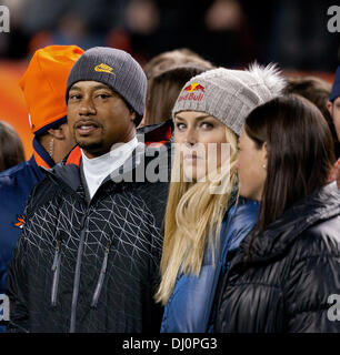 Tiger Woods, left, and Lindsey Vonn walk in the finish area of an ...