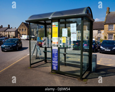 Rural bus shelter with community notices in Hartington village Peak District National Park Derbyshire Dales England UK Stock Photo