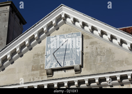 Sun dial on a classical pediment on Lewes Combined Crown and County Court building, High Street, Lewes, East Sussex. Stock Photo