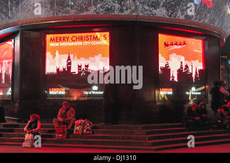 Piccadilly Circus, London, UK. 18th November 2013. The Eros Snow Globe in Piccadilly Circus is switched on. As well as being decorative, the snow globe provides protection against New Years revellers. Credit:  Matthew Chattle/Alamy Live News Stock Photo
