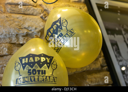 Balloons hanging from a wall at a 50th Golden wedding anniversary party. Stock Photo