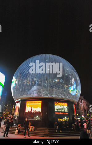 Piccadilly Circus, London, UK. 18th November 2013. The Eros Snow Globe in Piccadilly Circus is switched on. As well as being decorative, the snow globe provides protection against New Years revellers. Credit:  Matthew Chattle/Alamy Live News Stock Photo