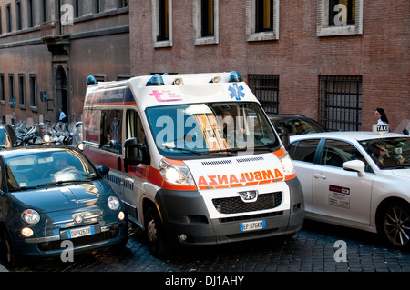 Ambulance on call trying to inch its way through traffic in Via Quattro Fontane in rione Trevi, Rome, Italy Stock Photo