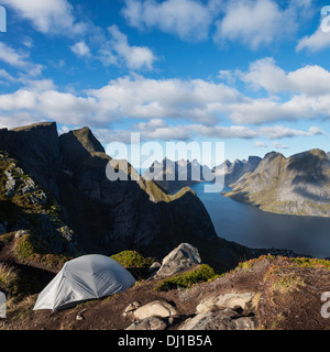 Tent camping on narrow ridge of summit of Reinebringen mountain peak, Reine, Moskenesoy, lofoten Islands, Norway Stock Photo