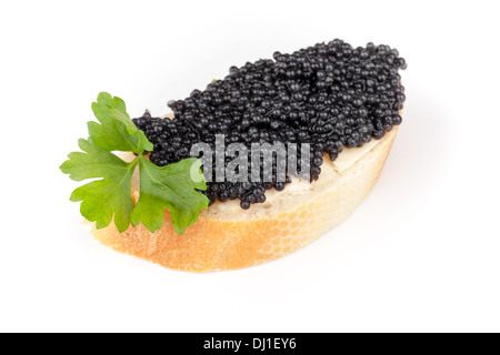 Small sandwich with black caviar isolated on white background Stock Photo