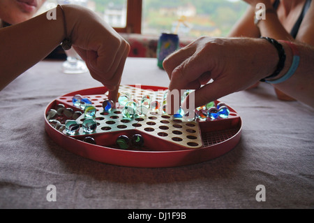 People playing Chinese Checkers Stock Photo