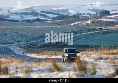 Cambrian Mountains, Powys, Wales, UK. 19th November 2013. A driver negotiates the B4520 road between Brecon and Builth Wells. Temperatures dropped to below freezing last night and a light dusting of snow fell on high ground. Credit:  Graham M. Lawrence/Alamy Live News. Stock Photo