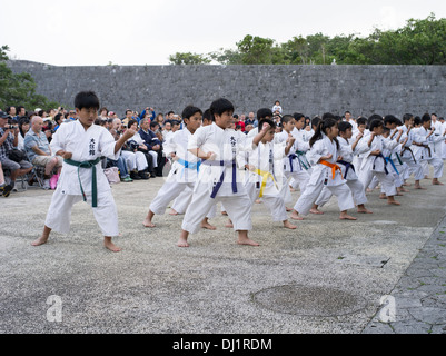 Children perform karate at Shuri Caslte, Naha City, Okinawa, Japan on Karate Day 2013. Okinawa is the birthplace of karate. Stock Photo