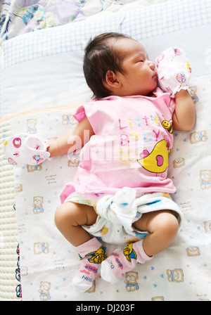 Newborn Asian baby girl sleeping Stock Photo