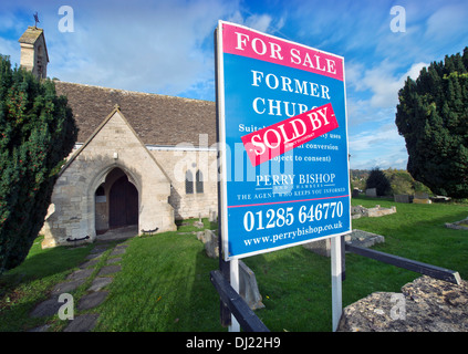 A 'For Sale' and 'Sold' sign on a church in Shortwood near Nailsworth, Gloucestershire UK Stock Photo