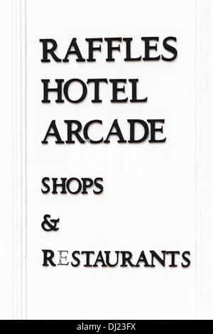 Raffles hotel arcade shops and Restaurant sign, Singapore Stock Photo