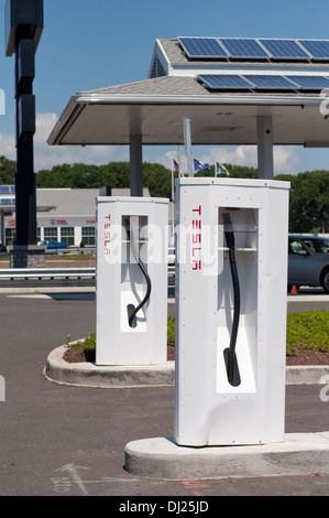 The Tesla Motors Supercharger Station in Milford, CT on I-95 N offers free charging for Tesla's electric vehicles. Stock Photo