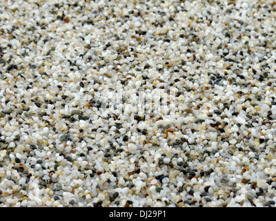 Tiny pebbles on a beach. Useful as a background or a backdrop. Stock Photo
