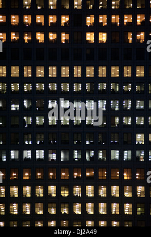 LONDON - NOV 1: people work in an office building in London on November 1, 2013. Full-time employees in the UK work longer hours Stock Photo