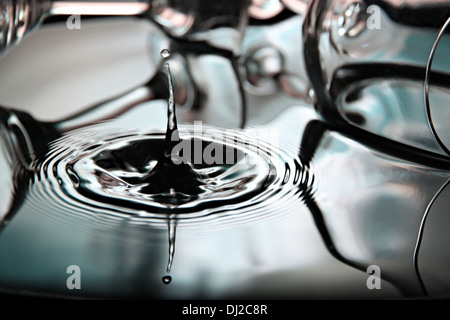 Closeup Pictures water drops a beautiful shape in Basin. Stock Photo
