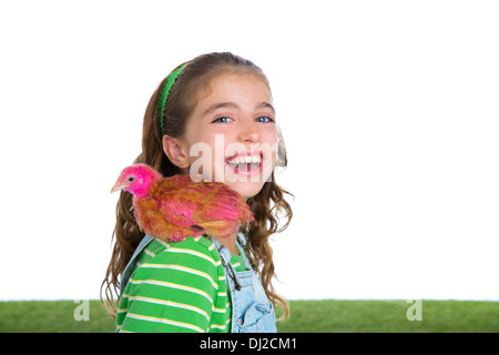 breeder hens kid girl rancher farmer playing with chicken chicks white background Stock Photo