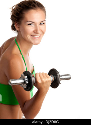 Cute fitness girl working out with dumbbells over white Stock Photo