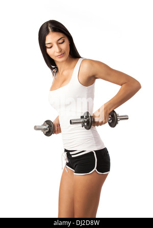 Cute fitness girl working out with dumbbells Stock Photo