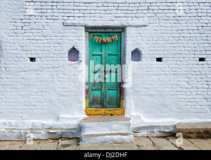 Old Indian village house green front doors. Andhra Pradesh. India Stock Photo