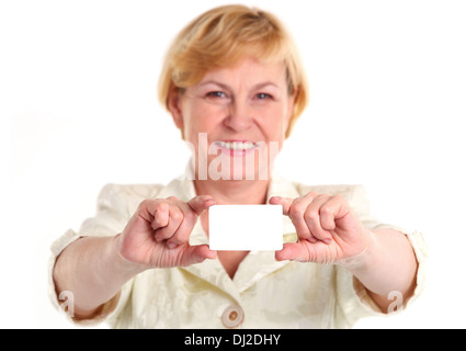 Smiling mature businesswoman holding blank empty card Stock Photo