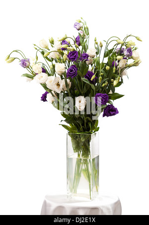Bouquet of eustoma flowers in vases, isolated on white Stock Photo