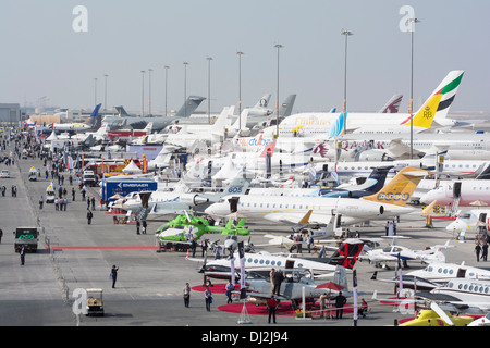 Many aircraft on apron at Al Maktoum International airport during Dubai Airshow 2013 in United Arab Emirates Stock Photo