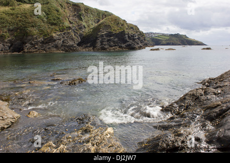 Talland Bay is a small and quiet place midway between Looe and Polperro. There are lots of rock pools to discover at low tide. Stock Photo