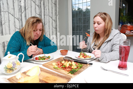 Mother and daughter having a catch up over a meal Stock Photo