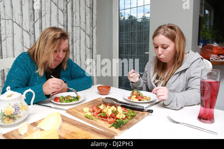 Mother and daughter having a catch up over a meal Stock Photo