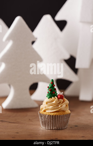 Christmas tree cupcake on white Xmas trees background Stock Photo