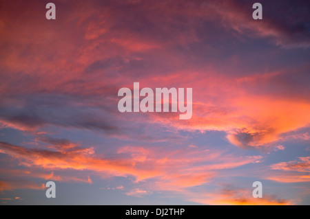 dh Sunset SKY WEATHER Red cloud sunset blue sky over Lanzarote dusk clouds sun set dramatic islands orange cloudscape clear background canary island Stock Photo