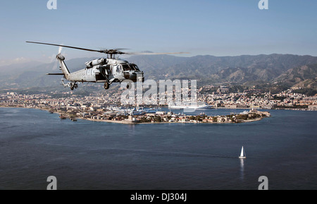 US Navy MH-60S Sea Hawk helicopter flies along the coast October 29, 2013 of Naples, Italy. Stock Photo