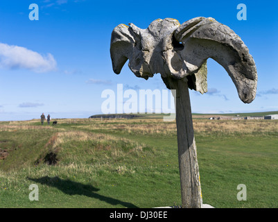 dh Whale bone BIRSAY ORKNEY Whalebone couple walking dog north coast footpath Stock Photo