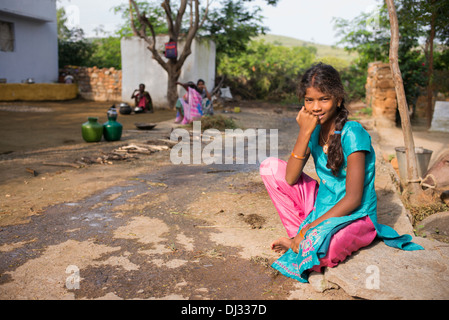 Indian teenage girl sat outside her rural Indian village home. Andhra ...